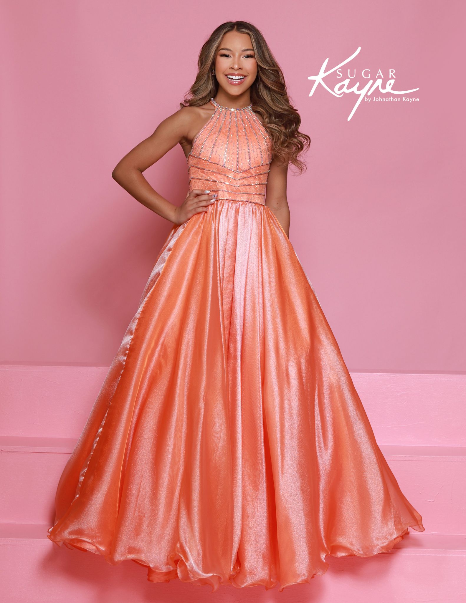 Girls orange halter neck pageant gown with rhinestone bodice and shimmer organza ballgown skirt - sugar kayne formal dress for stage or competition wear.